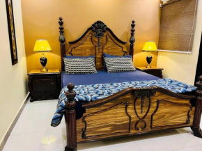 Bahria Town Lahore - NEXT INN Two Bedroom condo with free parking 203